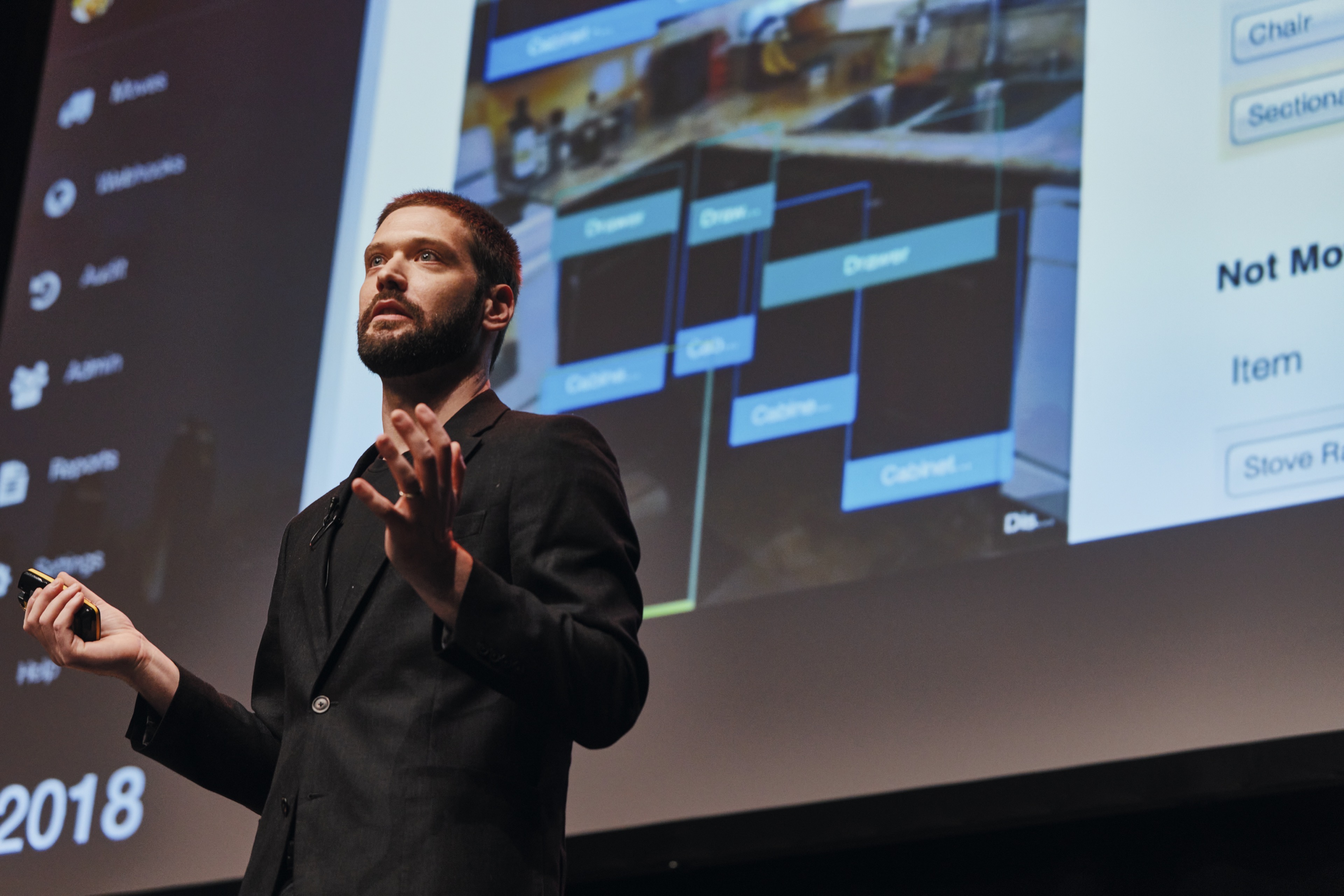 Zach Rattner presenting AI strategies on stage